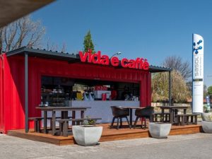 Stylish coffee shop converted from a shipping container, featuring a modern design and inviting atmosphere for a unique café experience.